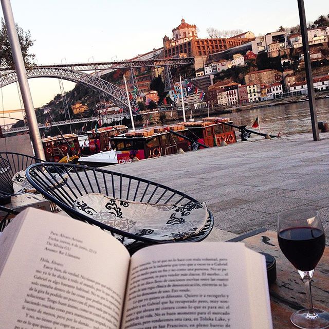 Reading a book in the Ribeira District in Porto, Portugal
